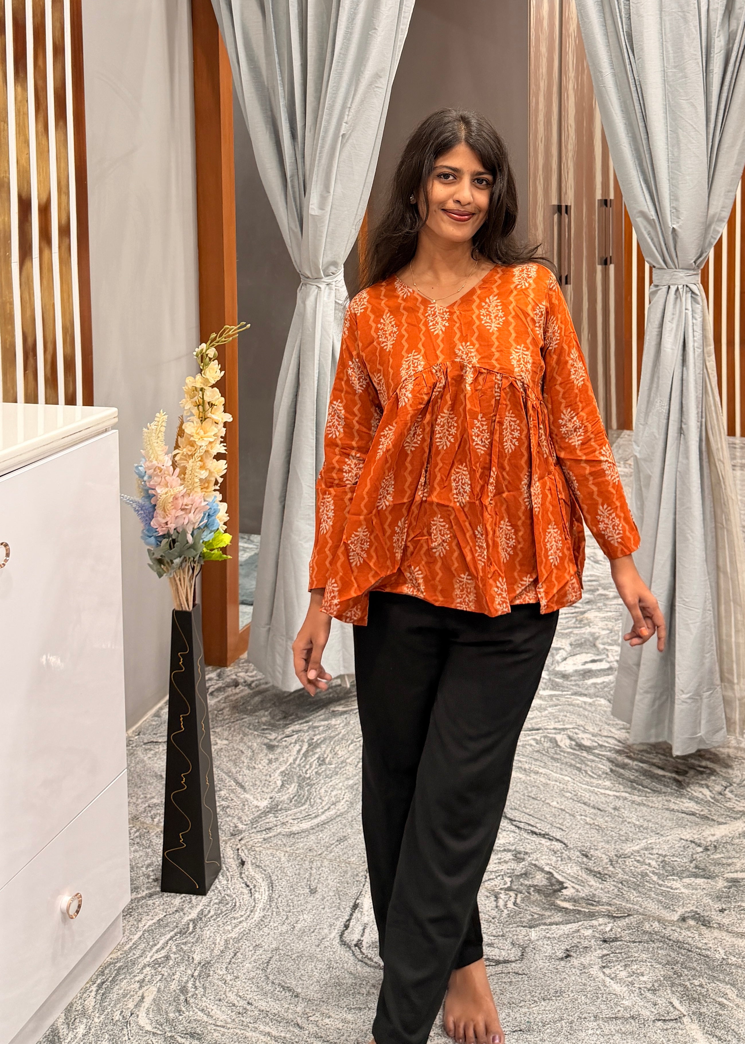 Orange peplum top