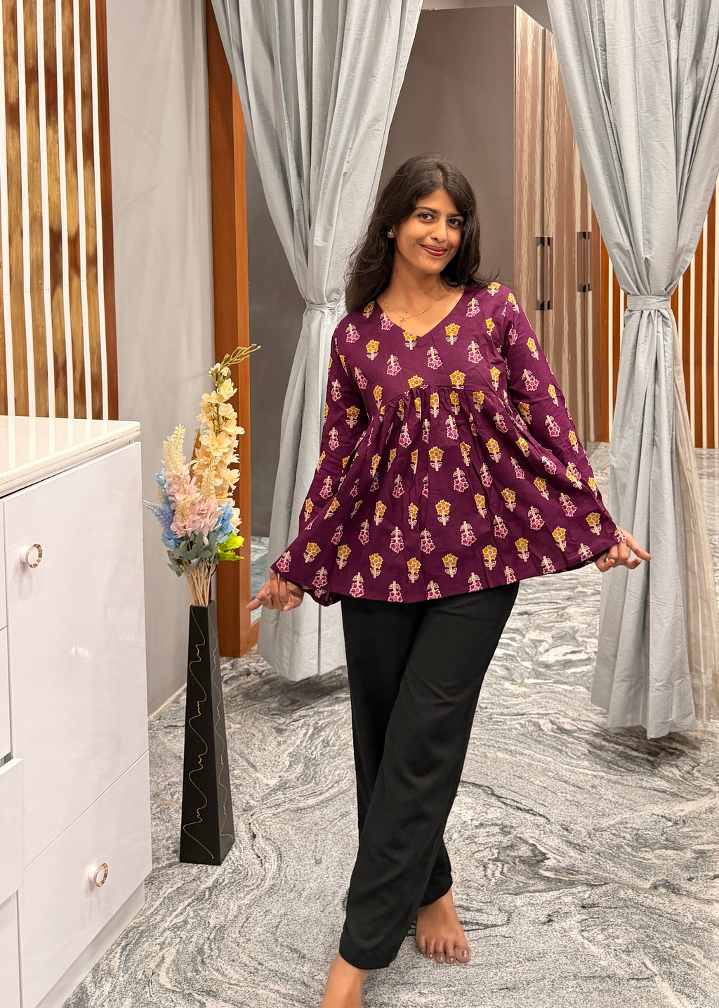 Purple floral peplum top