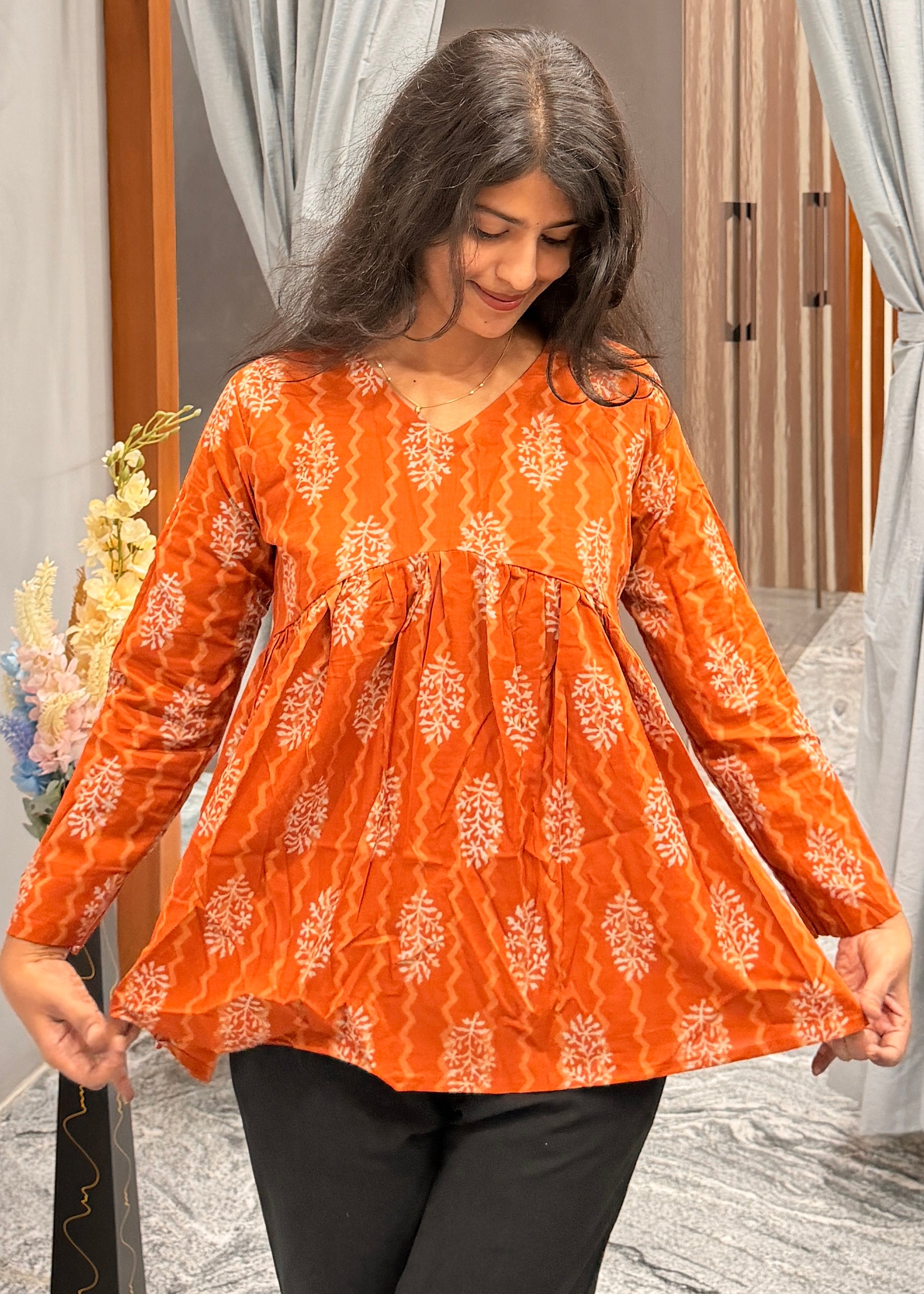 Orange peplum top